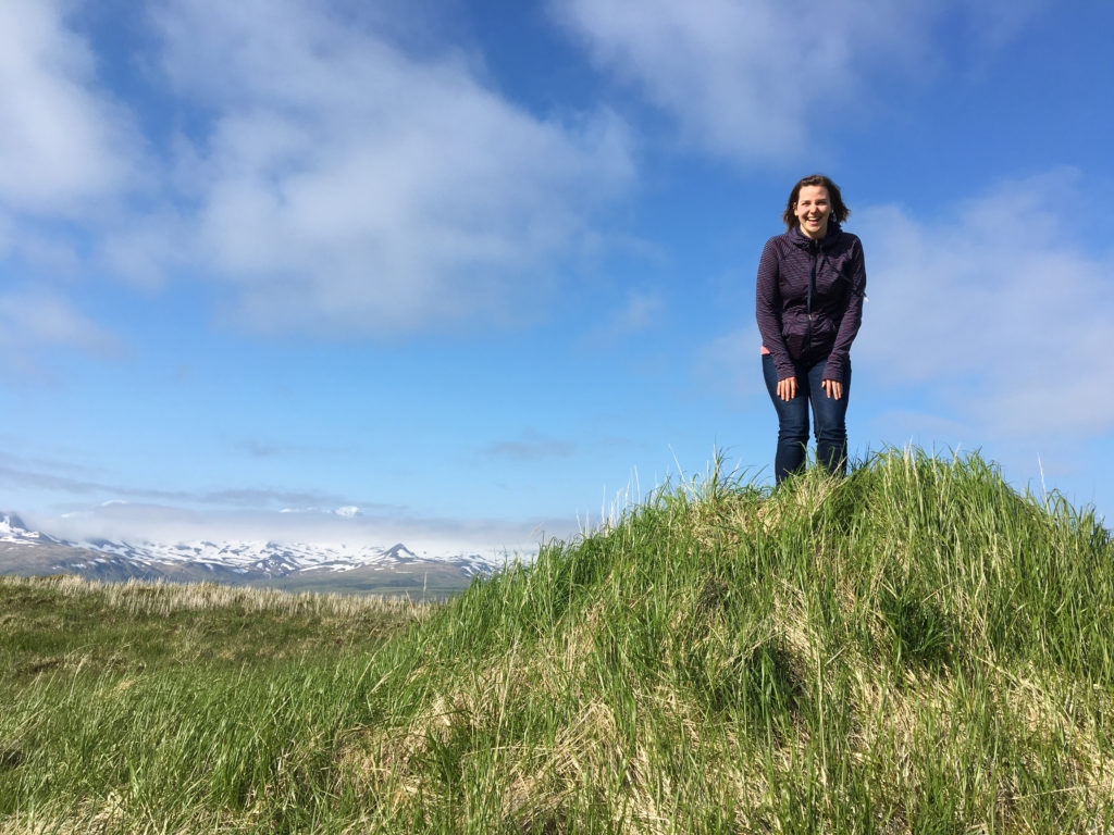 Robyn Giffen at the top of a tiny mountain in Atka, Alaska.