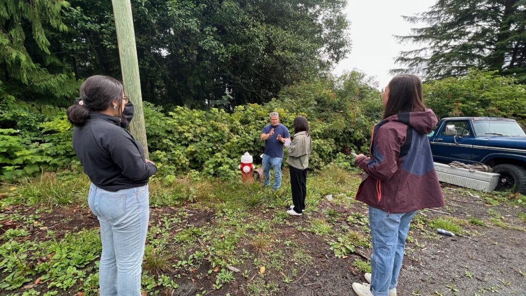 Jenna, Evan, Michayla and Lucy pick berries as an immersion activity on Tsulquate Reserve in Port Hardy. 